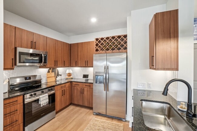 Kitchen with Granite Countertop and Stainless Steel Appliances - Inkwell at Baseline