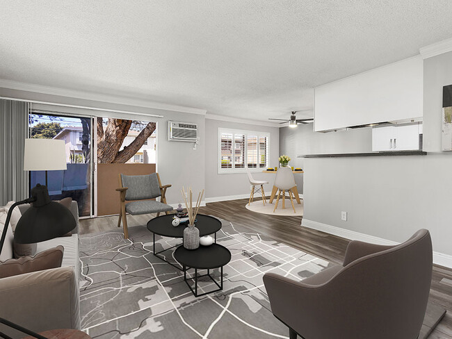 Hardwood floored living room with view of dining area. - National Apartments