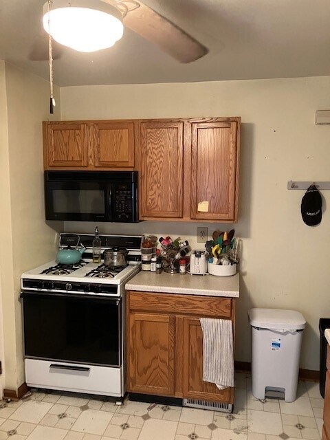 oven, gas stove with exhaust fan, and microwave - 17003 Hilliard Rd