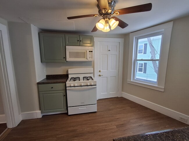 The door in this photo leads to the back stairs. - 13 Mulberry St