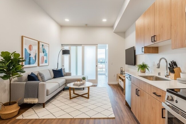 Building Photo - Atrium - Welcome to South Seattle’s Newest Modern Living Experience — Steps From the Light Rail