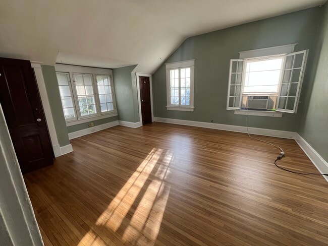 The family room has beautiful hardwood floors and lots of natural light. - 1521 South Center Street
