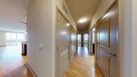 This contemporary apartment showcases a thoughtfully designed layout that maximizes space and functionality. The open-concept living area boasts gleaming hardwood floors, creating a seamless flow between the kitchen, dining, and living spaces. The kitchen is a chef's dream, equipped with rich wood cabinetry, sleek granite countertops, and high-end stainless steel appliances. 

The bathroom features a modern vanity with a granite countertop, complemented by neutral tile flooring and a glass-enclosed shower. Bedrooms offer plush carpeting and large windows that flood the space with natural light, while providing scenic city views.

The apartment's hallway is adorned with smooth wooden doors and recessed lighting, enhancing the overall modern aesthetic. Throughout the space, attention to detail is evident in the stylish light fixtures, window treatments, and thoughtful storage solutions.

This well-appointed apartment combines comfort and style, offering a perfect blend of urban living and home-like coziness. Its prime location at 5350 W Kennedy Blvd, Tampa, FL, ensures residents are at the heart of city life while enjoying a tranquil living environment.
