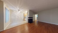 Located at 3825 McLaughlin Ave in the Mar Vista neighborhood of Los Angeles, this single-floor residence offers a thoughtfully laid-out living space with a blend of functional design and comfortable finishes throughout. The open-concept living and dining area is a standout, featuring rich hardwood flooring and a striking black-tiled fireplace that serves as a natural focal point. A ceiling fan provides additional comfort, while a sliding glass door fitted with vertical blinds invites natural light and offers outdoor access. The kitchen is seamlessly integrated into the living space and is equipped with light wood cabinetry, granite-style countertops, white appliances including a gas range, built-in microwave, refrigerator, and dishwasher, all set on easy-care tile flooring. The bedroom is generously sized, carpeted for warmth and comfort, and features a wide window with vertical blinds that allows for ample natural light. The bathroom is clean and well-appointed, with tile flooring, a full soaking tub and shower combination, and crisp white fixtures. Neutral wall tones throughout the home create a calm, versatile backdrop suitable for a variety of interior styles. This residence offers a practical and inviting layout in a well-connected Los Angeles neighborhood.
