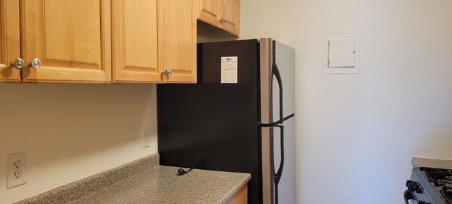 Building Photo - Top floor unit with a stunning open view! Walk to Longwood!