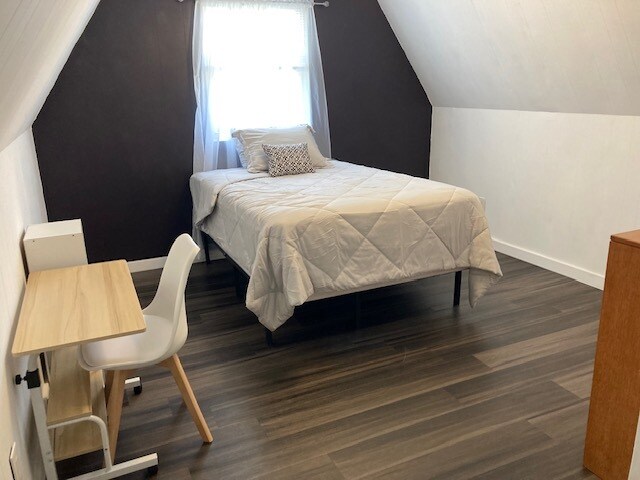 Upstairs bedroom includes full sized bed, dresser and half bath - 491 Grace Baptist Church Rd