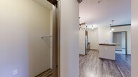 Located at 5400 Chenonceau Blvd in Little Rock, AR, this well-appointed 3-bedroom, 2-bathroom unit offers a thoughtfully designed single-level layout. The open-concept kitchen and living area serves as the heart of the home, featuring rich dark wood cabinetry, granite countertops, a breakfast bar peninsula with pendant lighting, and a full suite of stainless steel appliances including a refrigerator, electric range, and microwave. The kitchen flows seamlessly into the living room, which is finished with wood-style plank flooring, crown molding, and a ceiling fan. Natural light fills the living space through multiple windows with views to the outdoors, complemented by an exterior door that adds additional brightness and access. The three bedrooms are carpeted for comfort, each featuring a ceiling fan and windows that bring in natural light. The generously sized primary bedroom includes a large walk-in closet outfitted with wire shelving for organized storage. The two bathrooms offer tile flooring and a clean, functional design. A connecting hallway ties the bedroom wing together efficiently. Throughout the unit, neutral tones and consistent finishes create a cohesive and inviting atmosphere.