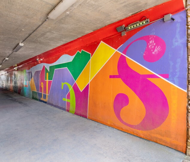 The Johns Creek Tunnel mural leads under Medlock Bridge Road near McGinnis Ferry Road