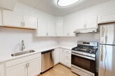 This one-bedroom, one-bathroom unit in Westborough, MA offers a well-organized layout across a single floor. The combined living and dining area is bright and open, featuring light hardwood-style flooring and a large sliding glass door that invites natural light and outdoor views. The space flows seamlessly from the hallway into the main living area, creating a comfortable and functional environment.

The kitchen is thoughtfully designed with white shaker-style cabinetry, light countertops, and a classic subway tile backsplash. Stainless steel appliances — including a gas range, dishwasher, and refrigerator — provide a modern, functional cooking space with ample storage and a light wood floor.

The bedroom is generously sized, finished with plush carpeting, and features a large window offering natural light and outdoor views. A built-in closet provides convenient storage, and the unit also includes two additional closets throughout, offering exceptional storage capacity.

The bathroom is clean and classic, featuring a full tub/shower combination, a white vanity with a sink, a mirrored medicine cabinet, and a charming black-and-white mosaic tile floor. Throughout the unit, crisp white walls and neutral finishes create a bright, move-in-ready atmosphere.