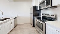 Located at 7622 Katella Ave in Stanton, CA, this efficiently designed one-bedroom, one-bathroom unit offers a well-organized single-floor layout. The combined living and dining area is bright and open, featuring light wood-style flooring and crisp white walls that create a clean, airy atmosphere. A textured ceiling adds character to the space, while a sliding glass door floods the room with natural light and provides direct access to a private balcony with outdoor views.

The kitchen is thoughtfully equipped with modern stainless steel appliances, including a refrigerator, electric range, over-the-range microwave, and dishwasher. White cabinetry and matching light flooring give the kitchen a fresh, cohesive look.

The bedroom offers a comfortable, intimate space with a dedicated closet for storage. The bathroom features a clean, all-white tub and shower combination with brushed nickel fixtures, complemented by the same light wood-style flooring found throughout the unit.

Overall, the unit presents a practical and modern living environment with consistent finishes, ample natural light, and functional spaces — ideal for those seeking a streamlined, low-maintenance home in Stanton, California.