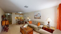 This single-floor residence in Kenner, Louisiana, offers a practical and comfortable layout across two bedrooms and two full bathrooms. The living room serves as the heart of the home, featuring neutral-toned carpet, warm beige walls, and natural light filtering through windows dressed with vibrant curtains. The open sightline connects the living area to a separate dining space, making it ideal for everyday living and entertaining.

The kitchen is efficiently designed with light wood cabinetry, white appliances including an electric range and refrigerator, and tile flooring that adds durability. A hallway leads to two well-sized bedrooms, each featuring ceiling fans with light fixtures, carpeted floors, and windows that invite natural light. Both bedrooms offer generous closet space, and the hallway provides additional storage through multiple built-in closets.

The two bathrooms are functionally appointed with tub-shower combinations and tile flooring. The overall color palette throughout the home is warm and neutral, creating a cohesive and inviting atmosphere. The layout is straightforward and efficient, with all rooms accessible from a central hallway that also houses additional storage closets, maximizing the utility of the space.