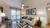 This 1-bedroom, 1-bathroom residence offers a thoughtfully designed single-floor layout that maximizes both comfort and functionality. The living area is bright and welcoming, featuring warm wood-style flooring, a ceiling fan with light fixture, and a sliding glass door that opens to a private balcony with outdoor views. Framed wall art and ample ambient lighting contribute to an inviting atmosphere. The living space flows seamlessly into a dedicated dining area, complete with track lighting overhead. The kitchen is equipped with stainless steel appliances, rich wood cabinetry, a granite-style countertop peninsula, and a tile backsplash — offering both style and practicality. The bedroom provides a comfortable retreat with plush carpeting, a ceiling fan, natural light from a window with outdoor views, and generous wall space. The full bathroom features a granite-topped vanity with wood cabinetry, a tub/shower combination with tile surround, and stone-look tile flooring. Throughout the residence, consistent design choices — including warm tones, natural textures, and thoughtful lighting — create a cohesive and comfortable living environment.