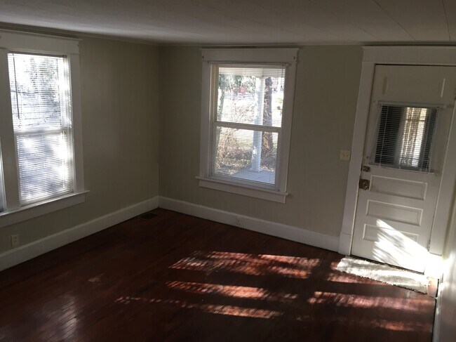 This is the family room looking towards the front porch. - 1542 South Center Street