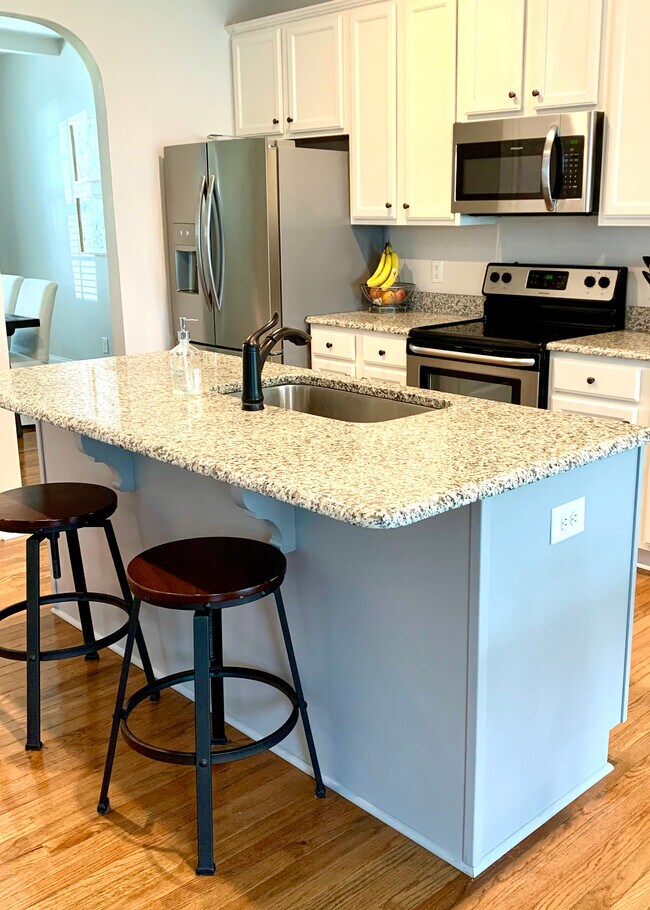 Open floorplan that offers flexibility for hosting and extra seating - 2 Crystal Ct