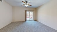 Located at 1500 Lewis Turner Blvd. in Fort Walton Beach, FL, this well-appointed single-floor residence offers 2 bedrooms and 2 bathrooms within a thoughtfully designed layout. The open-concept kitchen and living area serves as the heart of the home, featuring warm honey-toned cabinetry, granite countertops, a peninsula with pendant lighting, a tile backsplash, and a full suite of black appliances including a range, microwave, dishwasher, and refrigerator. The kitchen flows naturally into the living area, which is carpeted and finished with a ceiling fan and sliding glass door leading to an outdoor balcony. Both bedrooms are carpeted and fitted with ceiling fans; the primary bedroom includes a walk-in closet and a window with outdoor views, while the secondary bedroom also enjoys natural light through a large window. Each bathroom is finished with tile flooring, a tub/shower combination, and warm wood-toned vanity cabinetry with white countertops. A dedicated laundry room with washer/dryer hookups and overhead shelving adds everyday convenience. The space is completed by an entrance, hallway, and two closets, creating a functional and comfortable living environment.