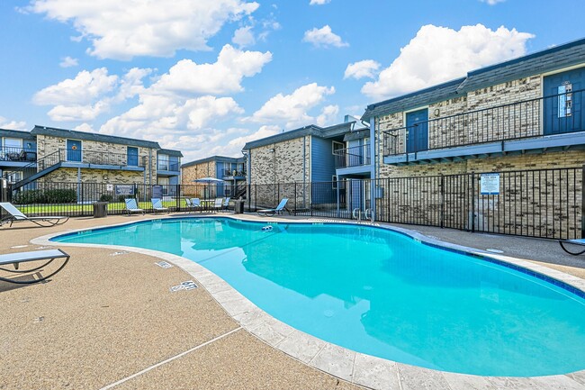 Sparkling pool and patio - Finley Square Apartments