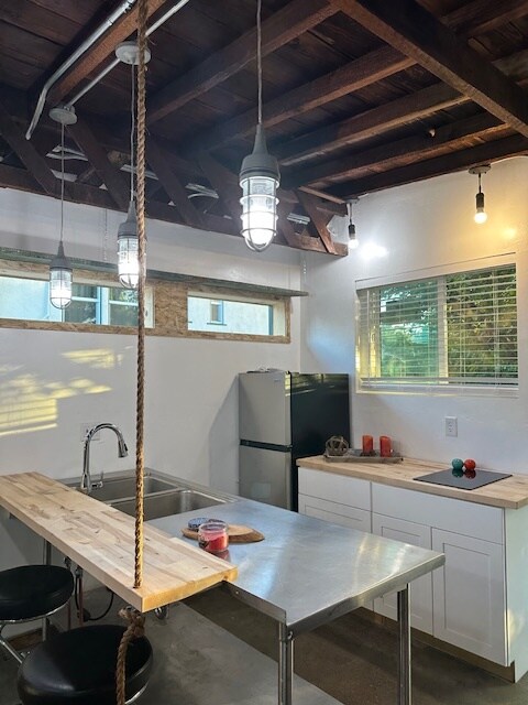 Large metal table with sink and bar - 24604 University Ave