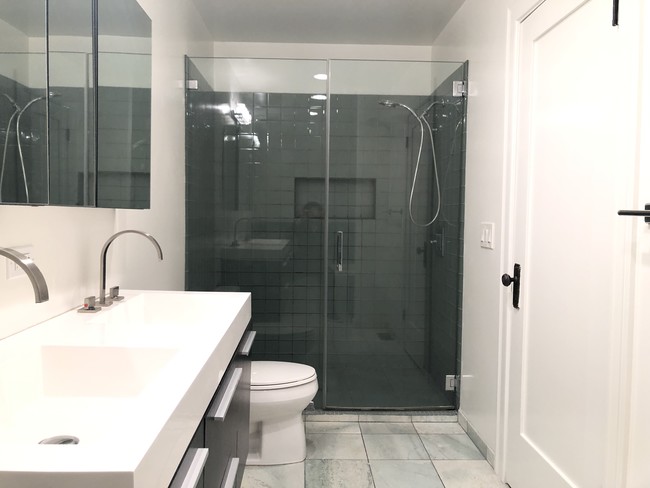 Double sink, glass-enclosed shower - 160 S Sycamore Ave
