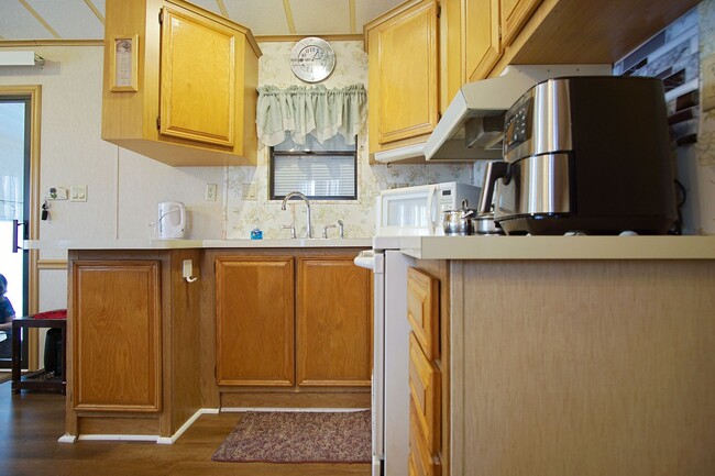 Building Photo - Home in 55+ Community now available!