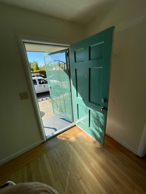 Step into front door with refinished hardwood floors and new paint throughout. - 3729 46th St