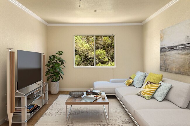 Lovely and comfortable living room area with plenty of natural light! - The Palms Apartments