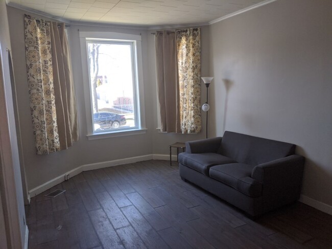Living room w/ picture window - 3627 S Seeley Ave