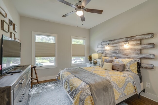 1st Bedroom Ensuite on the Main floor with Top Down Bottoms up Blackout Blings with Custom headboard - 1910 11th Ave N