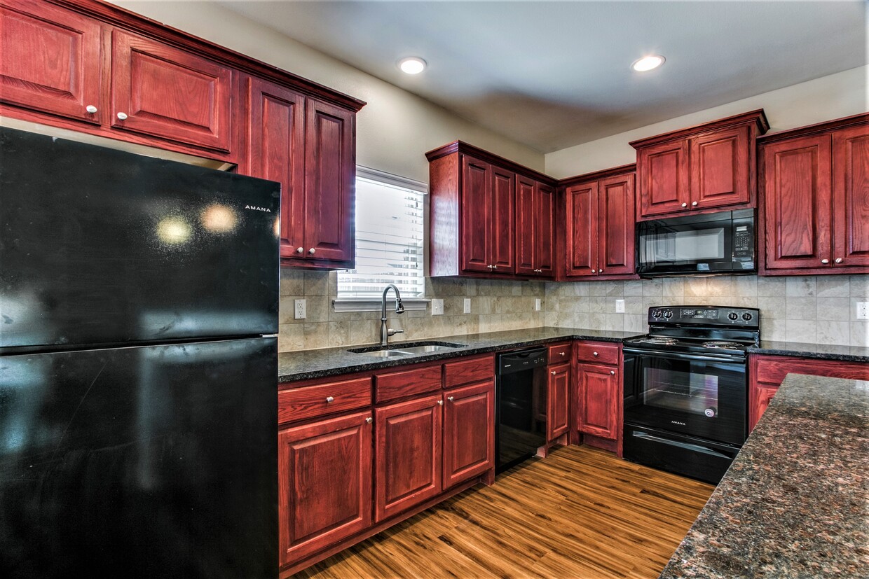 Gourmet Kitchen- Cherrywood raised panel cabinets and granite! - 4917 Sanger Circle