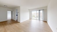 Located at 6 Tahoe Circle in Owings Mills, MD, this well-appointed one-bedroom, one-bathroom unit offers a clean, modern aesthetic across a single floor. The open living room is bathed in natural light streaming through large sliding glass doors that lead to a private balcony with outdoor views, creating a bright and airy atmosphere. Light-toned hardwood flooring extends throughout the main living area, complementing the crisp white walls for a fresh, cohesive look. The kitchen is thoughtfully designed with white shaker-style cabinetry featuring matte black hardware, light quartz countertops, a stainless steel gas range, a dishwasher, and a black pull-down faucet. A window above the sink brings in additional natural light. The spacious bedroom features plush wall-to-wall carpeting, a large window overlooking the outdoors, and two closets providing ample storage. The bathroom is finished with classic white subway tile surrounding a full tub-shower combination, chrome fixtures, and a clean, neutral palette. The overall ambiance throughout the unit is bright, clean, and move-in ready, offering a comfortable and functional living environment.
