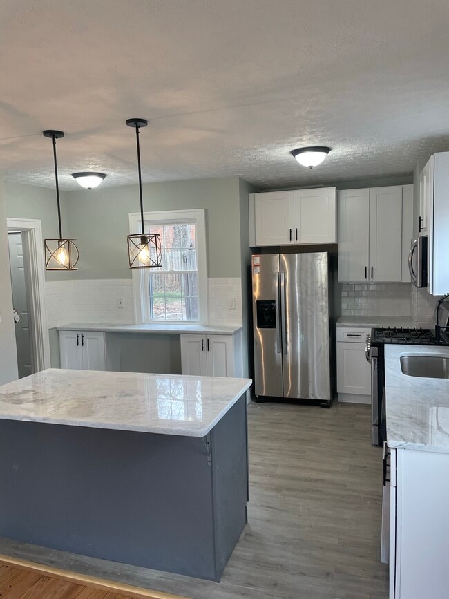 stainless Breakfast nook, steel appliances, and granite countertops - 3123 Keswick Rd
