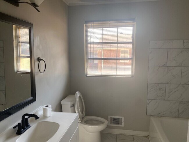 Building Photo - Four bedroom two bath house ready for new ...