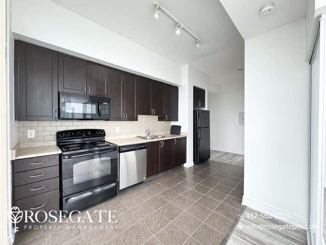 Building Photo - Newly Renovated 2-Bedroom Condo with 1.5 Baths – 800 Sq Ft