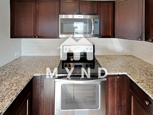 Building Photo - 6402 Melanzane Ave Unit 4