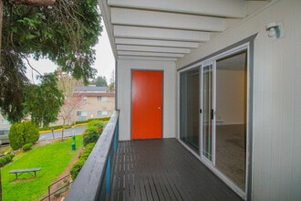 Enjoy fresh air and city views from your balcony patio at Foster Creek in Tukwila. - Foster Creek