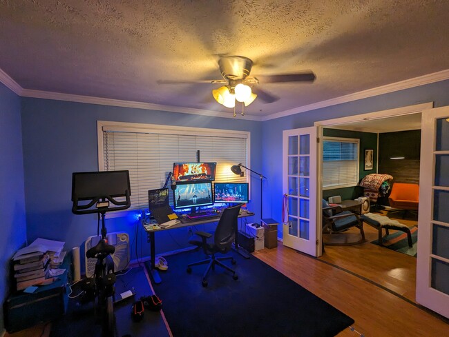 Dedicated office with a built-in bookshelf opposite the window. - 115 Biscayne Dr NW