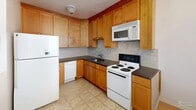 Located in Elkins Park, PA, this well-appointed one-bedroom, one-bathroom residence offers a thoughtfully organized single-floor layout with warm hardwood flooring flowing throughout the main living areas and bedroom. The living room is generously sized, bathed in natural light from large windows dressed with stylish curtains, and provides a welcoming atmosphere ideal for relaxing or entertaining. The space connects smoothly through two hallways to the remaining rooms, giving the layout an easy, functional flow. The bedroom is comfortably proportioned, featuring hardwood floors, multiple windows that invite natural light, and access to ample storage through multiple closets — four in total across the residence. The kitchen is well-equipped, showcasing warm honey-toned wood cabinetry that extends to the ceiling for abundant storage, dark granite countertops, a tile backsplash, and tile flooring. The full bathroom features classic tile walls, a dark wood vanity with a framed mirror, and a window that brings in natural light. Two hallways connect the spaces efficiently, contributing to the overall sense of organization and ease of movement throughout the home. This residence offers a practical and comfortable living environment in a convenient Elkins Park location.