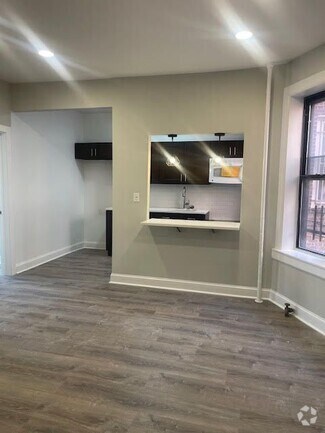 Building Photo - 1443 White Plains Rd