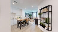 Located at 6535 Alvarado Road in San Diego, CA, this thoughtfully designed one-bedroom, one-bathroom residence offers a smart, efficient layout across a single floor. Light wood flooring flows throughout the space, complementing a clean, modern aesthetic defined by white walls and recessed lighting.

The open-concept kitchen is outfitted with sleek white flat-front cabinetry, stainless steel appliances including a gas range and French door refrigerator, a tile backsplash, and under-cabinet lighting. A butcher block island with bar seating connects the kitchen seamlessly to the dining and living areas, making it ideal for both everyday living and entertaining.

The living room is bright and welcoming, with large windows dressed in floor-length curtains that invite natural light. A door provides additional access, adding to the airy feel of the space.

The generously sized primary bedroom features a ceiling fan, ample closet storage, and windows with curtains, creating a calm and comfortable retreat. The bathroom includes a full soaking tub with a marble-style tile surround and built-in shelving for storage.

Throughout the residence, thoughtful design details and a cohesive neutral palette create a contemporary and functional living environment.