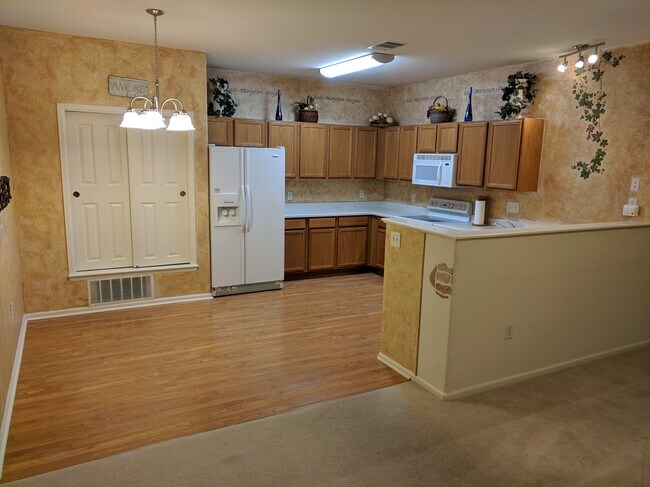 Kitchen and dining area - 3282 E 103rd Dr