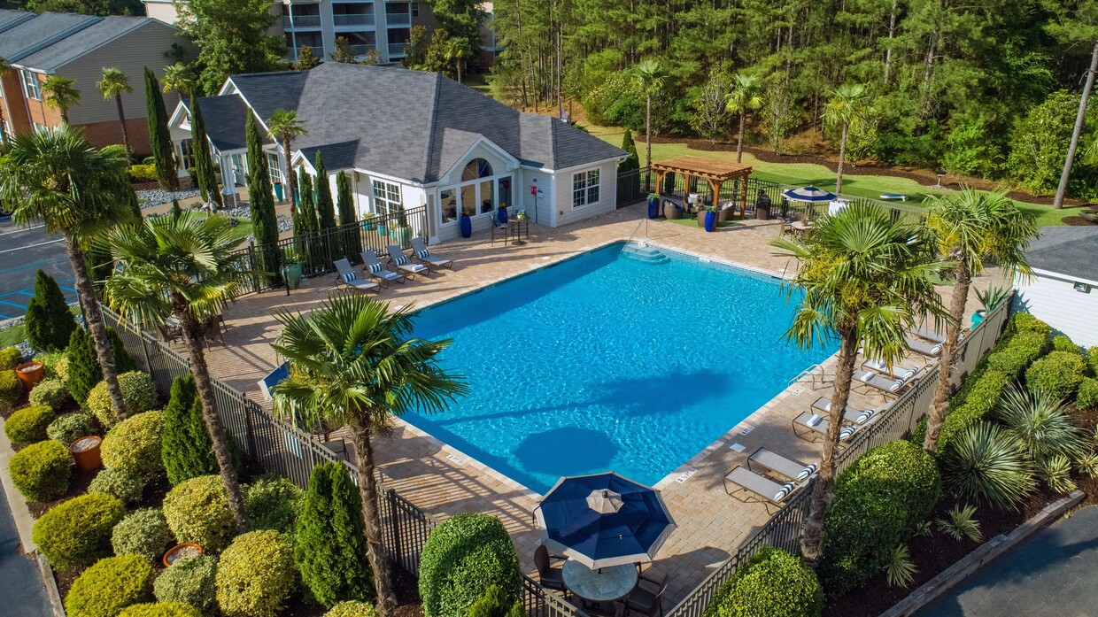 Bask in sun-soaked serenity by our expansive resort-style pool with a sprawling sundeck. - The Legends at Lake Murray