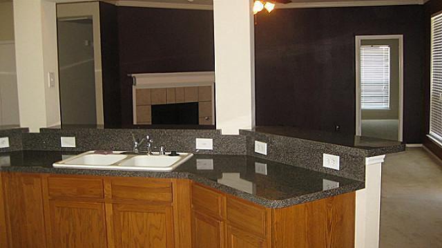 Building Photo - Spacious 4-bedroom, 2-bath single-story corner-lot home with open kitchen, two living areas, and ...