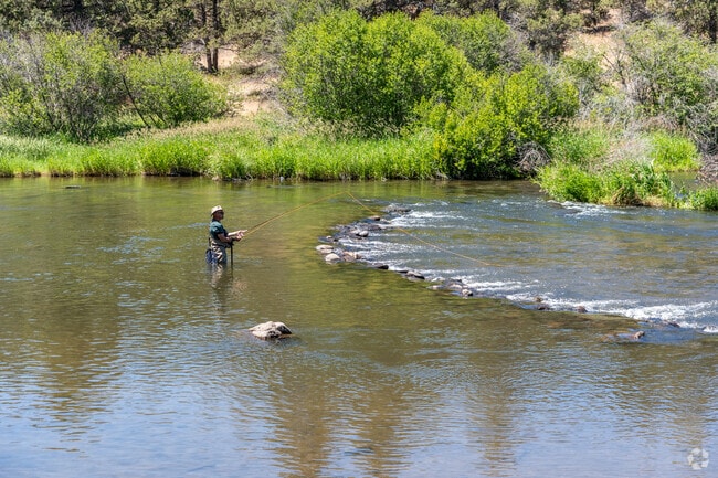 Fisherman can wade into the clear waters at Cline Falls State Park for fly fishing in Redmond.