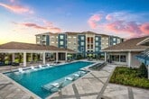 This contemporary 1150 square foot residence in Kenner, LA offers a harmonious blend of style and functionality. The single-floor layout maximizes space efficiency, featuring one bedroom and two full bathrooms. The heart of the home is an open-concept living area that seamlessly integrates the kitchen and living room, creating a spacious feel.

The kitchen is a standout feature, boasting crisp white cabinetry, stainless steel appliances, and a generous granite-topped island. Pendant lighting adds a touch of modern elegance. The cooking space is well-equipped with a built-in microwave, range, and dishwasher, perfect for culinary enthusiasts.

The bedroom, measuring 130 square feet, provides a comfortable retreat. Two bathrooms offer convenience and luxury, with one featuring a separate shower and bathtub, along with a double vanity topped with marble.

Storage is abundant throughout the home, with two closets and a dedicated laundry area. The property also includes thoughtful details like crown molding, recessed lighting, and a cohesive color palette of whites and neutrals.

Light-toned wood flooring runs throughout, creating a bright and airy atmosphere. Large windows allow natural light to flood the space, enhancing the open feel. The property's modern design is complemented by clean lines and a minimalist aesthetic, making it an ideal canvas for various decorating styles.