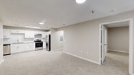 This 1,090 square foot single-story residence in Carrollton, GA, offers a harmonious blend of comfort and functionality. The home features three bedrooms, including a spacious 140 square foot primary bedroom, and three full bathrooms. The modern kitchen is a highlight, boasting crisp white cabinetry, granite countertops, and stainless steel appliances. Subway tile backsplash and ample counter space create an inviting cooking environment.

The bathrooms have been tastefully updated with contemporary fixtures, including white vanities with granite countertops and tub-shower combinations. Light-toned vinyl plank flooring runs throughout the main living areas, while plush carpeting adds warmth to the bedrooms. The neutral color palette provides a blank canvas for personalization.

Storage is plentiful with three closets, including wire shelving systems for optimal organization. The home's layout promotes easy flow between rooms, with a central hallway connecting the living spaces. Natural light floods the interior through windows in each room, enhancing the open feel of the space. Located at 912 Lovvorn Rd, this property offers a perfect balance of modern amenities and practical living space.