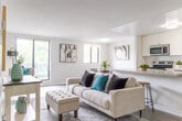 Located at 170 Old Carriage Dr in Kitchener, Ontario, this 2-bedroom, 1-bathroom unit offers a clean, modern aesthetic with a bright and cohesive design throughout. The open-concept living room is bathed in natural light from large windows that overlook greenery, and features light wood-style flooring and neutral walls that create an airy, welcoming atmosphere. The well-appointed kitchen is a functional highlight, boasting white shaker-style cabinetry, granite countertops, a classic subway tile backsplash, and a full suite of stainless steel appliances including a range, dishwasher, refrigerator, and microwave. A generous counter peninsula provides additional prep and serving space. The primary bedroom offers a comfortable layout with a double closet and easy access to the hallway. The second bedroom is versatile and bright, with a window overlooking the outdoors. The shared bathroom is tastefully finished with a white vanity, granite countertop, and a bathtub-shower combination. Consistent light wood flooring flows through the living areas and bedrooms, tying the space together cohesively. A centrally located hallway connects all rooms efficiently, enhancing the overall functionality of this well-designed unit.