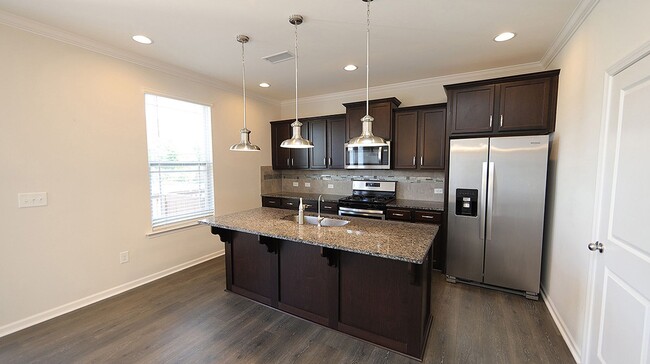 Building Photo - Upgraded & Spacious End Unit Townhome in V...