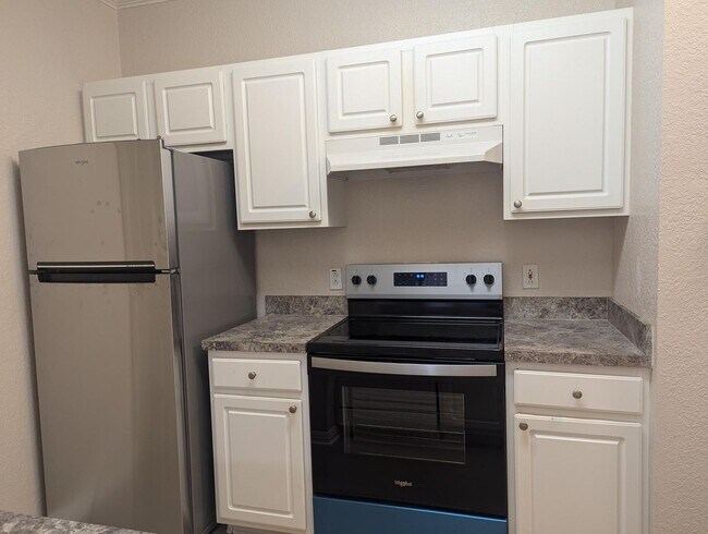 Building Photo - Peaceful, quiet & comfortable! New Vinyl Plank flooring & Appliances