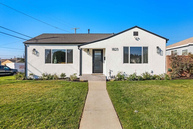 Front of the house. Corner unit home with beautiful space. - 1823 N Ditman Ave