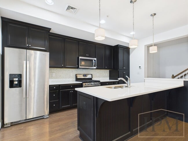 Building Photo - 2-bedroom 2.5 bath Luxury Townhome located...