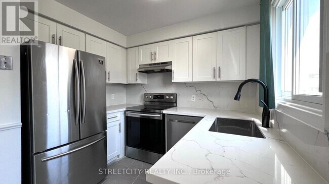 Building Photo - 1430-1430 Jalna Blvd